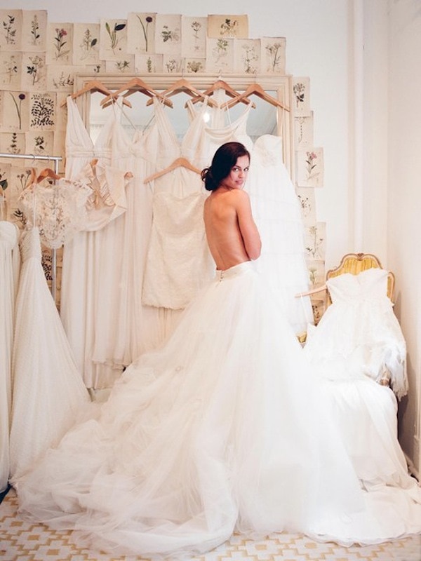 Elizabeth-Messina-bride-trying-on-wedding-dresses